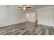 Spacious bedroom with ceiling fan, walk-in closet, and en-suite bathroom at 911 8Th Sw Ave, Largo, FL 33770