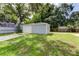 Detached garage with driveway and fenced yard at 911 8Th Sw Ave, Largo, FL 33770