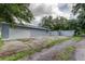 Newly built home with gray siding and a detached garage at 911 8Th Sw Ave, Largo, FL 33770