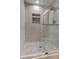 Modern shower with marble tile and glass enclosure at 911 8Th Sw Ave, Largo, FL 33770
