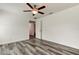 Bright bedroom with ceiling fan and gray vinyl flooring at 911 8Th Sw Ave, Largo, FL 33770