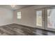 Bright dining room with hardwood floors and French doors leading to the backyard at 911 8Th Sw Ave, Largo, FL 33770
