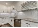 Modern kitchen with white cabinets, granite countertops, and stainless steel appliances at 911 8Th Sw Ave, Largo, FL 33770
