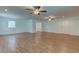 Spacious living room featuring hardwood floors and ceiling fans at 911 8Th Sw Ave, Largo, FL 33770