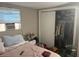 Bedroom with a double bed, closet, and window coverings at 1874 Douglas Ave, Clearwater, FL 33755