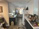 Open concept kitchen with white and dark cabinets, and a view into the dining area at 1874 Douglas Ave, Clearwater, FL 33755
