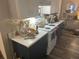Modern kitchen with white and dark cabinets, and a marble-look countertop at 1874 Douglas Ave, Clearwater, FL 33755