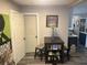 Small dining area with a table and chairs, adjacent to the kitchen and living room at 1874 Douglas Ave, Clearwater, FL 33755