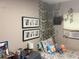 Bright bedroom with a bed, nightstand, and wall decor at 1874 Douglas Ave, Clearwater, FL 33755