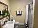 Clean bathroom with shower, vanity, and updated flooring at 1874 Douglas Ave, Clearwater, FL 33755