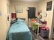 Small bedroom with twin bed and workspace at 1874 Douglas Ave, Clearwater, FL 33755