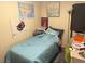 Small bedroom with twin bed and lots of light at 1874 Douglas Ave, Clearwater, FL 33755