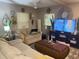 Living room with neutral colored couch and coffee table at 1874 Douglas Ave, Clearwater, FL 33755