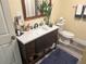 Bathroom features vanity with storage and modern finishes at 1874 Douglas Ave, Clearwater, FL 33755