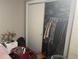 Spacious bedroom closet with ample hanging space at 1874 Douglas Ave, Clearwater, FL 33755