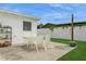 Relaxing patio with string lights and a table for outdoor dining at 1300 63Rd N Ave, St Petersburg, FL 33702