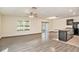Open living room with hardwood floors, high ceilings and a staircase at 3508 Diamond Leaf Ct, Valrico, FL 33594