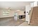 Open living room with hardwood floors, high ceilings and a staircase at 3508 Diamond Leaf Ct, Valrico, FL 33594