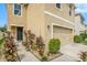 Two-story house with walkway, landscaping and a two-car garage at 3508 Diamond Leaf Ct, Valrico, FL 33594