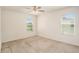 Bright bedroom with ceiling fan and neutral colored carpet at 3508 Diamond Leaf Ct, Valrico, FL 33594