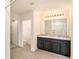 Bathroom with double vanity, large mirror, and separate shower at 3508 Diamond Leaf Ct, Valrico, FL 33594