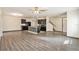 Open living room with hardwood floors, high ceilings and a staircase at 3508 Diamond Leaf Ct, Valrico, FL 33594