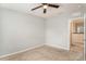 Bedroom with ceiling fan and access to a hallway at 3508 Diamond Leaf Ct, Valrico, FL 33594