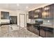 Spacious kitchen with dark cabinets, granite countertops and stainless steel appliances at 3508 Diamond Leaf Ct, Valrico, FL 33594