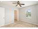 Bedroom with ceiling fan, window, and closet at 3508 Diamond Leaf Ct, Valrico, FL 33594