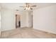 Spacious bedroom with ceiling fan and access to bathroom at 3508 Diamond Leaf Ct, Valrico, FL 33594