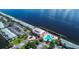 Aerial view of waterfront community with clubhouse and resort-style pool at 5144 Salmon Se Dr # A, St Petersburg, FL 33705
