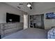 Bright bedroom featuring a comfy bed, a large closet, and a TV at 5144 Salmon Se Dr # A, St Petersburg, FL 33705