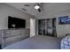 Bright bedroom featuring a comfy bed, a large closet, and a TV at 5144 Salmon Se Dr # A, St Petersburg, FL 33705