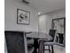 Modern dining area with a unique table and black leather chairs at 5144 Salmon Se Dr # A, St Petersburg, FL 33705
