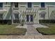 Building exterior showcasing a light green building with a walkway at 5144 Salmon Se Dr # A, St Petersburg, FL 33705