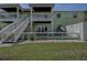 Two-story building with private patio and stairs at 5144 Salmon Se Dr # A, St Petersburg, FL 33705