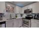 Renovated kitchen, granite countertops, stainless steel appliances at 5144 Salmon Se Dr # A, St Petersburg, FL 33705