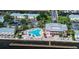 Community pool with surrounding lounge chairs and waterfront access at 5144 Salmon Se Dr # A, St Petersburg, FL 33705