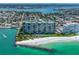 Aerial view of beachfront resort and surrounding neighborhood at 7100 Sunset Way # 405, St Pete Beach, FL 33706