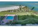 Aerial view of resort community, pool, and beach access at 7100 Sunset Way # 405, St Pete Beach, FL 33706