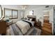Cozy bedroom featuring a comfortable bed, natural light, and window with city views at 7100 Sunset Way # 405, St Pete Beach, FL 33706