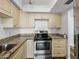 Updated kitchen, featuring stainless steel appliances and granite countertops at 7100 Sunset Way # 405, St Pete Beach, FL 33706