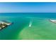 Aerial view of a calm waterway and coastline at 7100 Sunset Way # 405, St Pete Beach, FL 33706