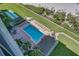 Elevated view of resort pool with lounge chairs and beach access at 7100 Sunset Way # 405, St Pete Beach, FL 33706