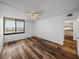 Bedroom with view, wood-look floors and kitchen access at 7100 Sunset Way # 405, St Pete Beach, FL 33706
