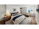 Comfortable main bedroom offering natural light, waterfront views, hardwood floors, and a serene ambiance at 7100 Sunset Way # 405, St Pete Beach, FL 33706