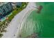 Aerial view of condo complex near beach with pool and beach access at 7100 Sunset Way # 405, St Pete Beach, FL 33706