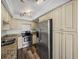Modern kitchen with stainless steel appliances and granite countertops at 7100 Sunset Way # 405, St Pete Beach, FL 33706