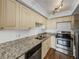 Modern kitchen featuring stainless steel appliances and granite countertops at 7100 Sunset Way # 405, St Pete Beach, FL 33706
