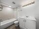 Clean bathroom with white vanity and bathtub at 7100 Sunset Way # 405, St Pete Beach, FL 33706